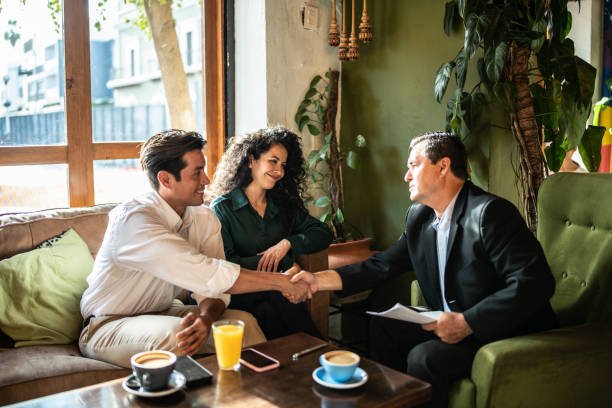 A family enjoys a walk by their house, representing the services of Home Loan Experts-3 Keys Lending.