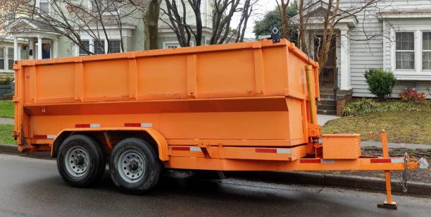 An orange garbage truck, symbolizing a dumpster rental service, is prominently displayed.
