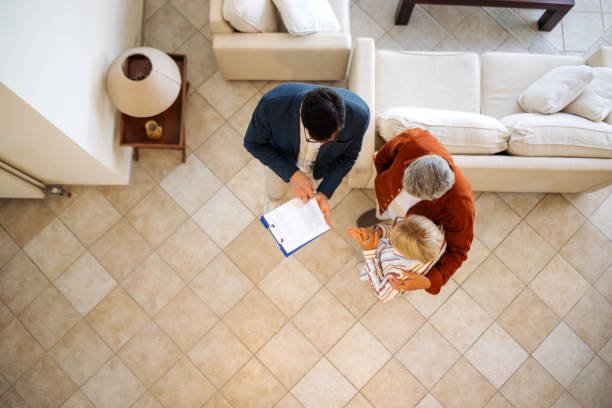 A handshake between two people over a desk, indicating a mortgage transaction near Rock Hill.