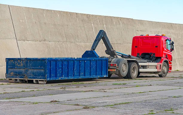 roll-off dumpsters standing next to each other, ready for waste disposal.