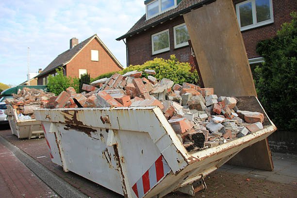 A street scene featuring a dumpster overflowing with rubble, highlighting the removal of construction debris.