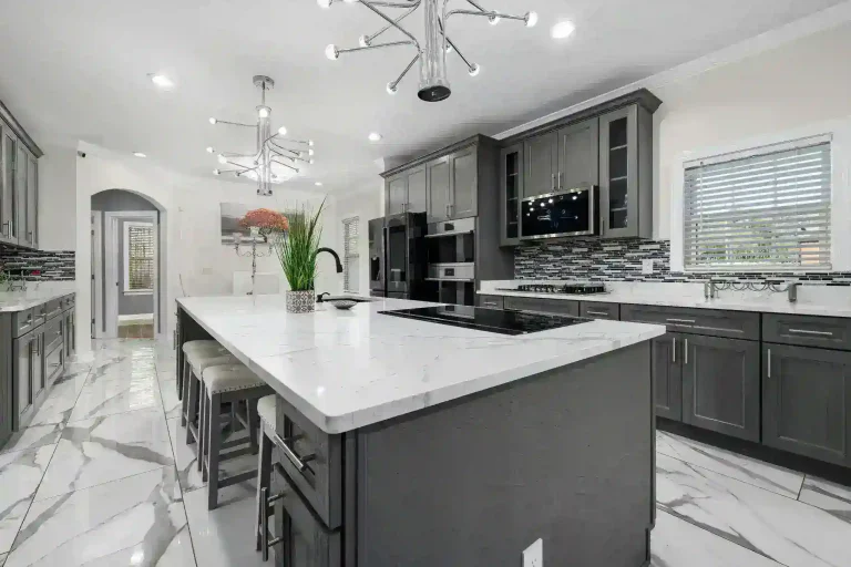 Modern kitchen with white cabinets and sleek countertops