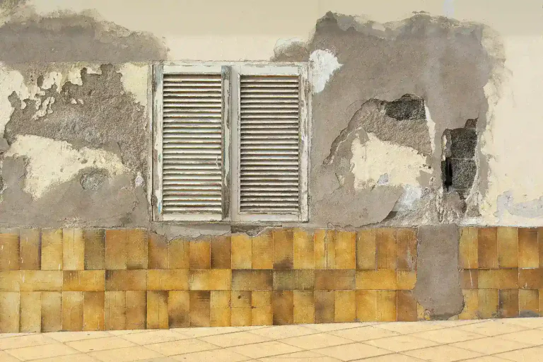 Old house with peeling paint and damaged exterior