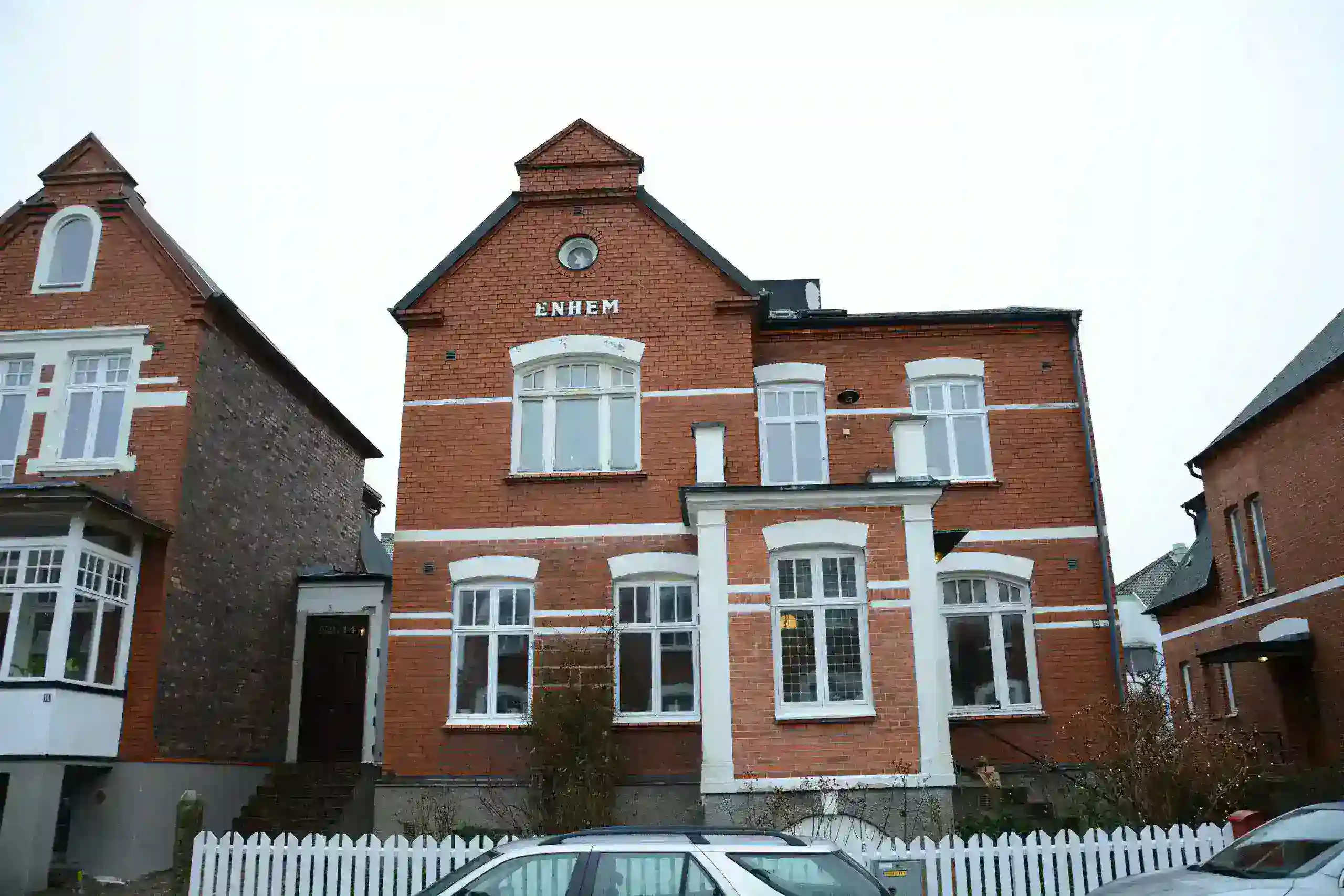 Exterior of a house painted grey with white trim