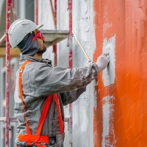imgi_32_man-helmet-painting-wall-with-word-scaffolding-it_1109006-84207