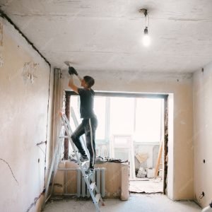 imgi_45_man-removes-old-paint-from-ceiling-with-spatula_99692-1449