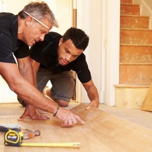 imgi_49_two-men-laying-wood-panel-flooring-house_1218270-5020