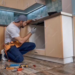 imgi_50_young-caucasian-repairman-screwing-new-kitchen-furniture_386185-6081