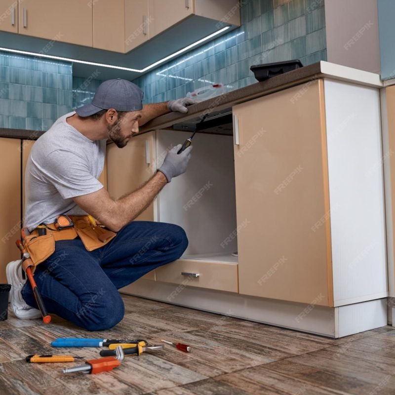 imgi_50_young-caucasian-repairman-screwing-new-kitchen-furniture_386185-6081