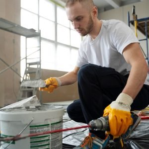 imgi_51_full-shot-man-mixing-construction-composition_23-2149328071